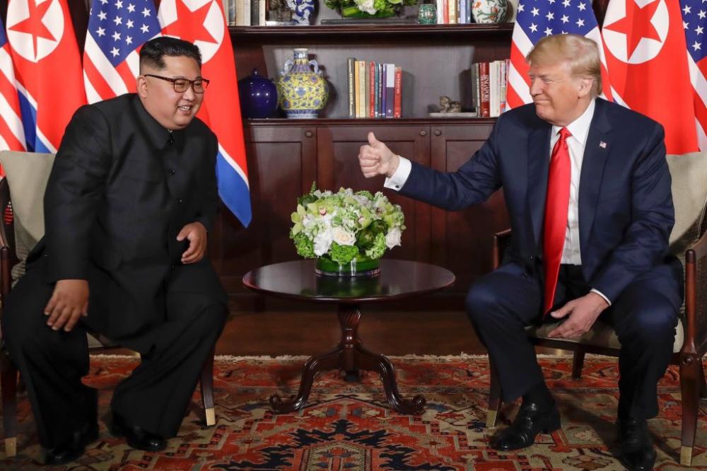 Trump pledges to end war games, Kim commits to denuclearization