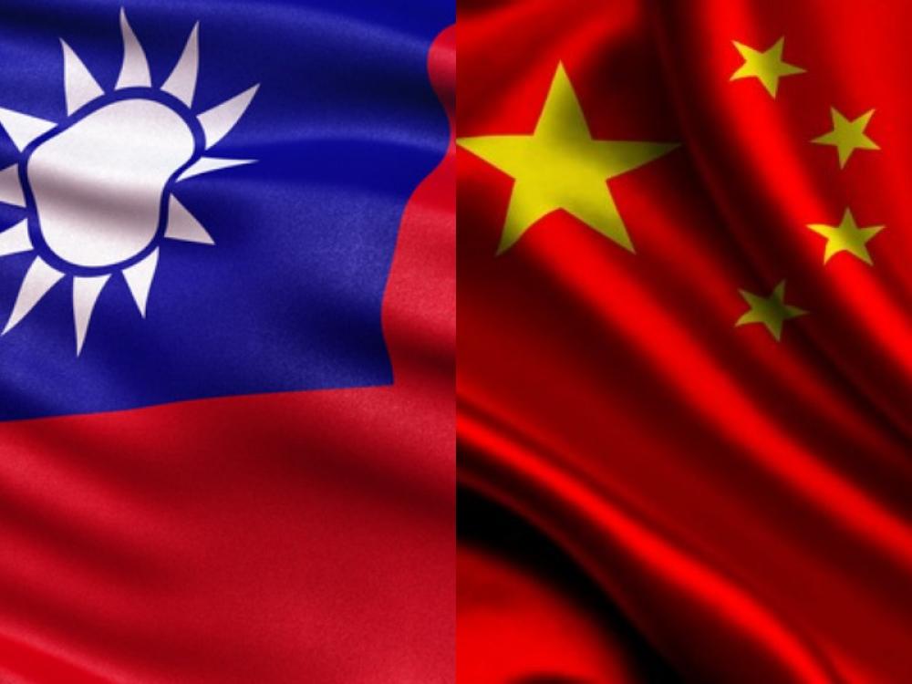 China warns Taiwan against spying; TV show details latter