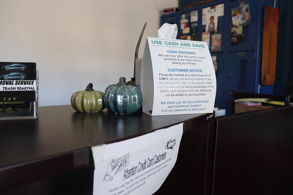 Signs on the front desk of West Main Auto Repair in Lexington, Ga. Photo by Julianna M. Russ