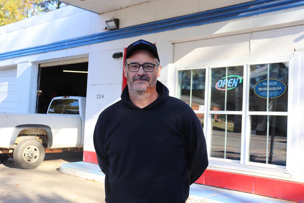 Gene Bradford, who owns West Main Auto Repair in Lexington, Ga. , says most pays with cash or card. Photo by Julianna M. Russ