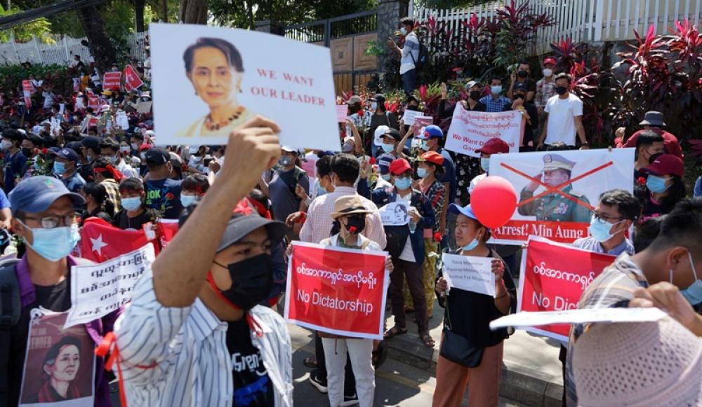 File image of demonstrators denouncing the military coup in Myanmar, by Voice of America (VOA) via Wikimedia Creative Commons