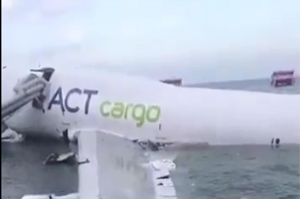 Cargo plane skids off Hong Kong runway, crashes into sea; two ground staff killed Cargo plane skids off Hong Kong runway, crashes into sea; two ground staff killed