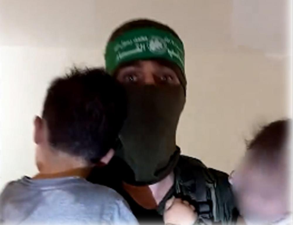 IDF releases video where armed Hamas members are seen playing with abducted Israeli children