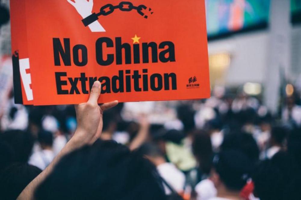 Hong Kong protests: Demonstrators sing and boo Chinese anthem