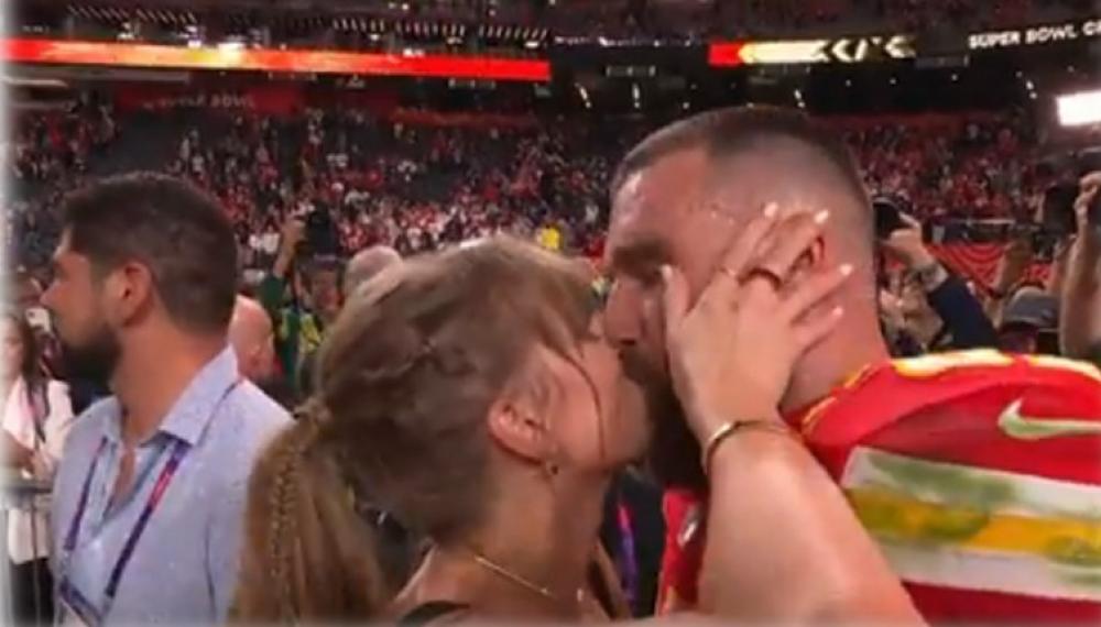 Singing sensation Taylor Swift kisses and hugs Travis Kelce after Kansas City Chiefs' Super Bowl victory in Los Vegas